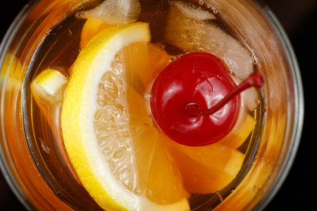 Lemon cocktail with cherry, honey and ice.の写真素材