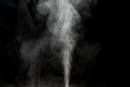 Water vapor on black close-up. view of white water vaporの写真素材