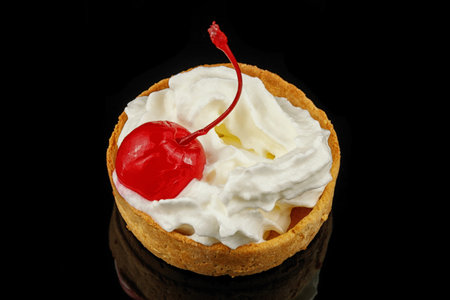 Baskets of pastries with cherry and cream. Cake basket with meringue and cherriesの写真素材