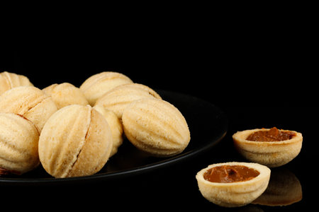 Peanut cookies with condensed milk. Homemade cookies with boiled condensed milk. cookies or cakes in the shape of nuts filled with boiled condensed milkの写真素材