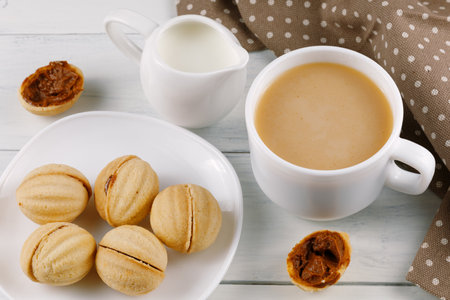 Traditional breakfast with homemade cookies. nuts with condensed milknuts with condensed milkの写真素材