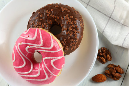 Donuts on a plate. Delicious sweet breakfast. top viewの写真素材