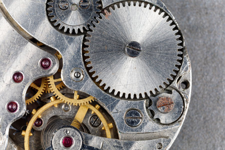 Clock mechanism close-up. Gears and cogs in clockwork watch mechanismの写真素材