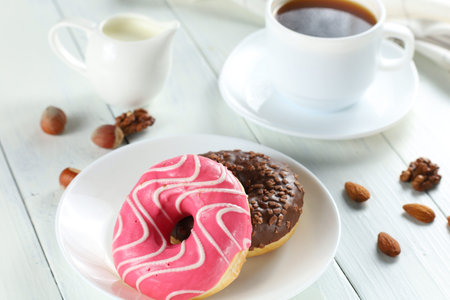Donuts on a plate. Delicious sweet breakfast.の写真素材