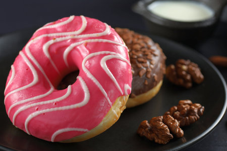 Donuts on a plate. Delicious sweet breakfast.の写真素材