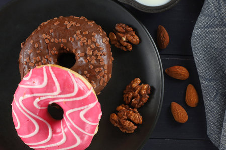 Donuts on a plate. Delicious sweet breakfast. top viewの写真素材