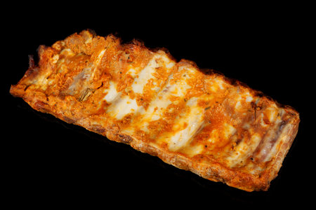 Baked rib on black background isolate.の写真素材