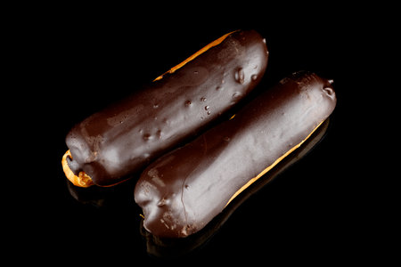 Chocolate eclairs on black isolate. top viewの写真素材