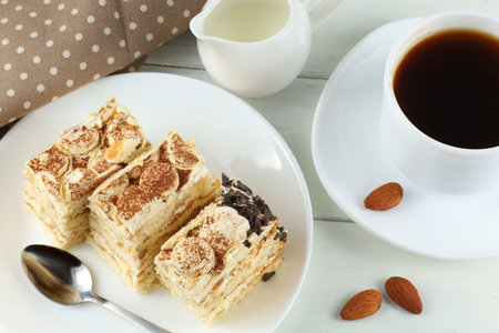 Tiramisu, coffee with milk. Sweet delicious food. A slice of homemade tiramisu cakeの写真素材