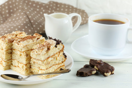 Tiramisu, coffee with milk. Sweet delicious food. Italian dessert tiramisu on a plate and espresso coffeeの写真素材