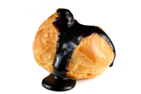 Eclair with chocolate on white isolateの写真素材