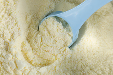 Yellow powder for children's nutrition in a jar. Sports nutrition - proteinの写真素材