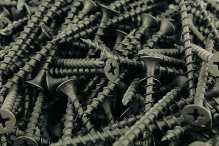 Screws black background. Close-up of metal screwsの写真素材