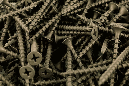 wood screws close-up. many black screws. Background from steel screwsの写真素材