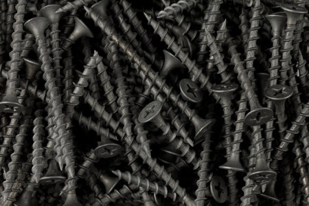 Screws black background. Close-up of metal screwsの写真素材
