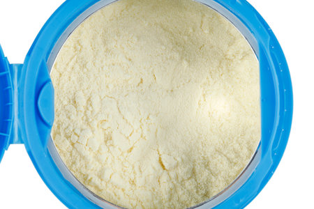 Yellow powder for children's nutrition in a jarの写真素材