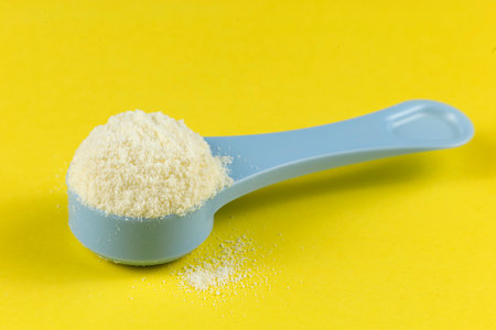 Sports nutrition in a spoon. Wheat protein powder for athletes.の写真素材