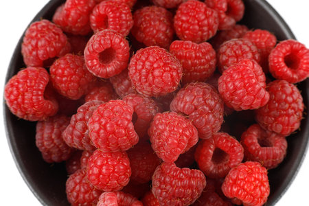 Raspberries much in bowl close-up.の写真素材