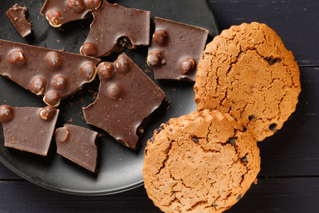 Pieces of chocolate with oatmeal cookies.の写真素材