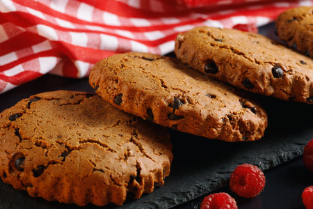 Oatmeal cookies with chocolate and berries.の写真素材