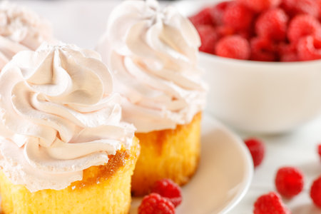 Raspberry cupcakes with berries on a white background.の写真素材