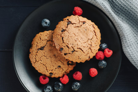 Oatmeal cookies with berries on darkの写真素材