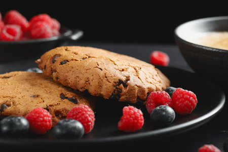 Oatmeal cookies with cappuccino and berriesの写真素材