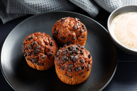 Muffins chocolate cupcakes with cappuccinoの写真素材