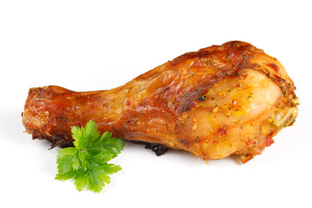 Fried chicken leg with dill greens isolateの写真素材