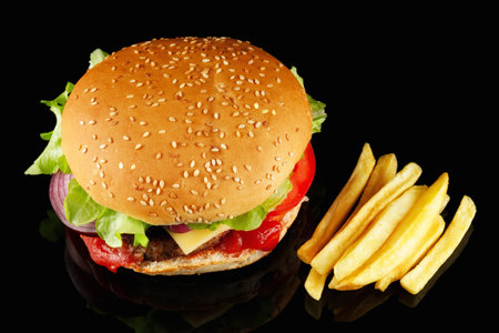 burger with lettuce, tomato, cheese and cutlet top view.の写真素材