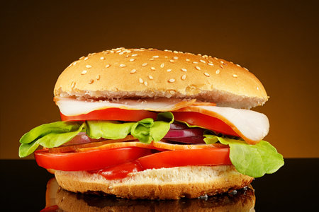 Tasty burger close-up. home made beef burger with tomato, cheese, beef and salad.の写真素材