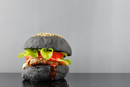 Black burger homemade. Juicy black burger place for text cope spaceの写真素材
