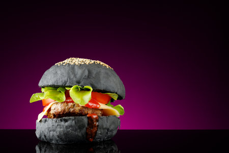 Black burger homemade. Juicy black burger place for text cope spaceの写真素材