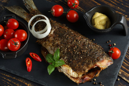Fried carp fish on the table. served fried carpの写真素材