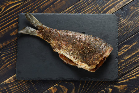 Fried carp fish on the table.の写真素材