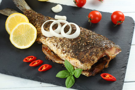 Fried fish dish. Diet with fish. Tasty and appetizing fish with vegetablesの写真素材