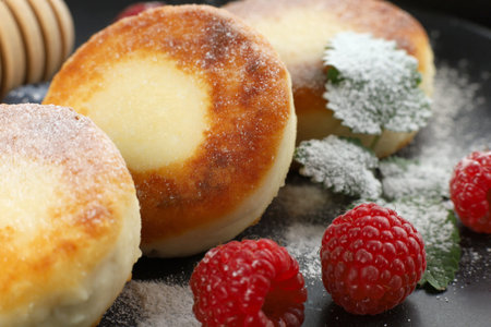 Cottage cheese fritters with raspberry berries. Farmers cheese pancakes sirniki or syrnikiの写真素材