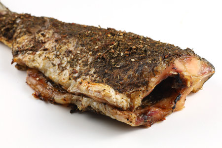 Baked fish on the table. baked carp.の写真素材