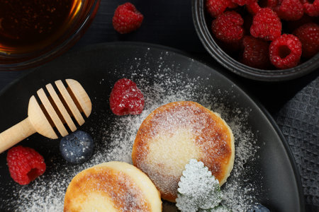 Cottage cheese fritters with raspberry berries. Cottage pancakes with berriesの写真素材