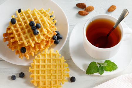 Belgian waffles with tea and berries.の写真素材