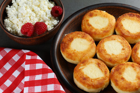 curd fritters and raspberries. Cheese fritters, pancakes or syrnikiの写真素材
