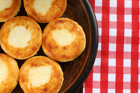 curd fritters on a plate in the village. traditional delicious food.の写真素材