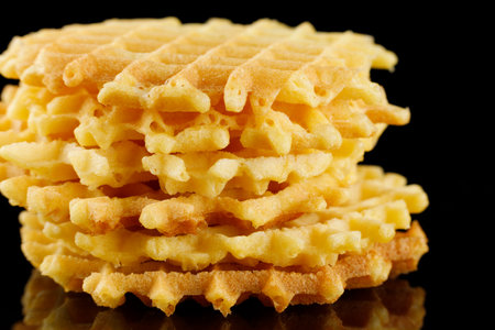 Belgian waffles on a black background.の写真素材