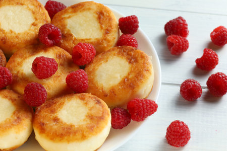 curd fritters and raspberries. Tasty breakfast and eating healthy.の写真素材