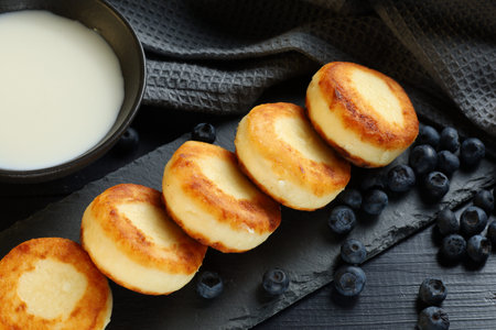 curd fritters with blueberry. Cottage cheese pancakes or syrniki with blueberryの写真素材