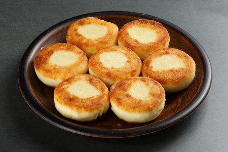 curd fritters on a plate. Cottage cheese on a rustic backgroundの写真素材