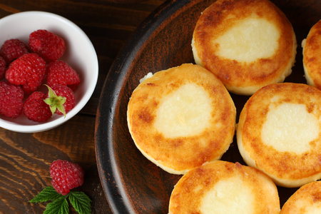 curd fritters on a plate in the village. traditional delicious food.の写真素材