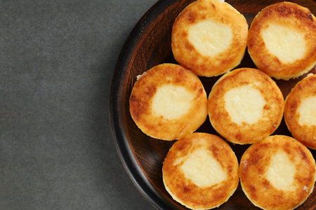 curd fritters on a plate. Sweet delicious cottage cheese pancakesの写真素材