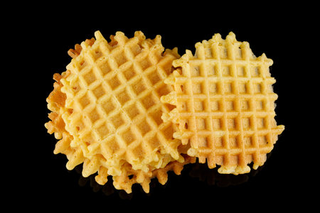 Belgian waffles on a black background.の写真素材