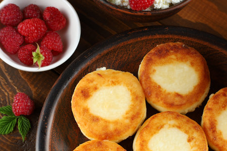 curd fritters and raspberries. top viewの写真素材